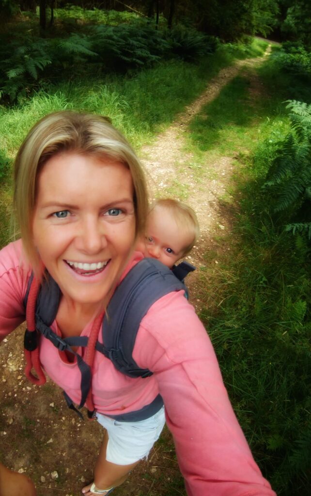 Lady enjoying parenthood and hill walking with baby