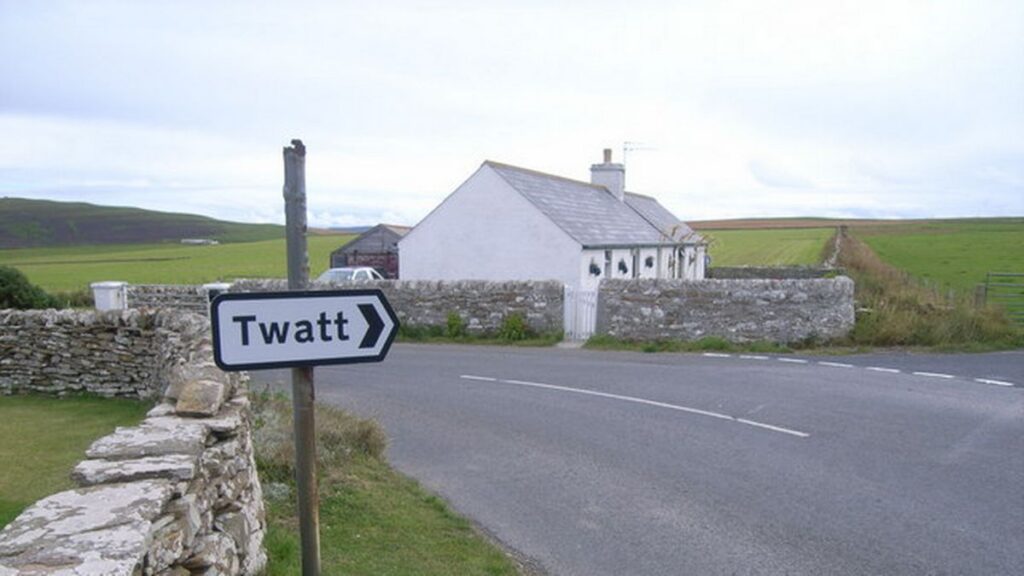 Funny Place Names UK Road Sign pointing to Twatt