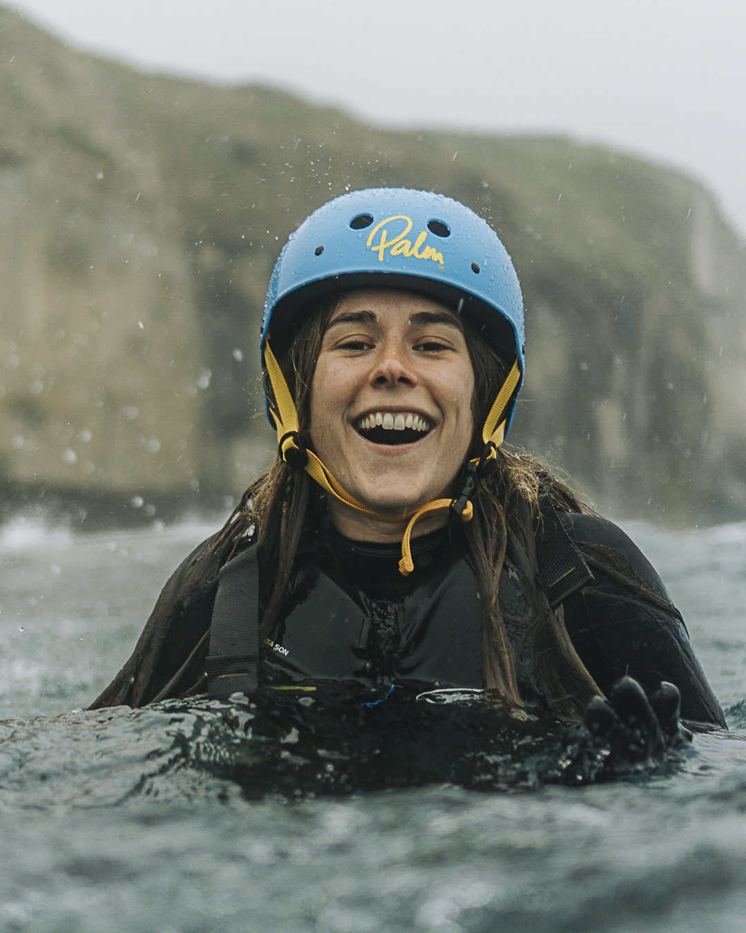 Girl Smiling in the water during coasteering session