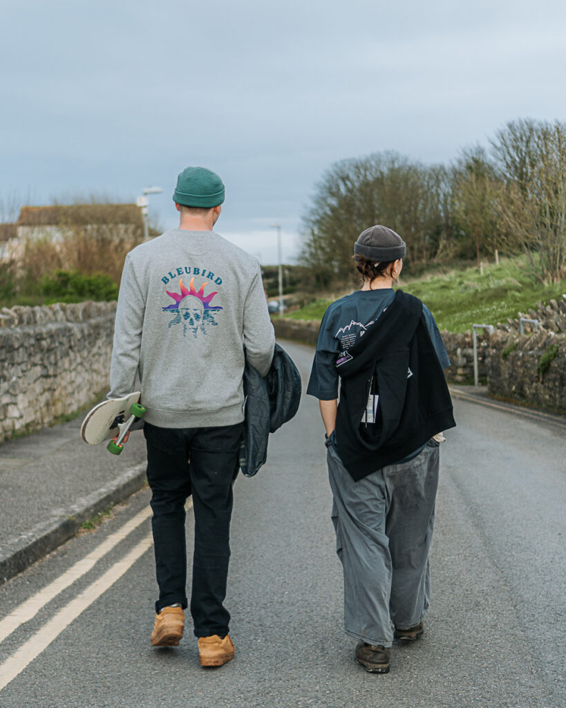 Couple walking down a road in outdoor apparel