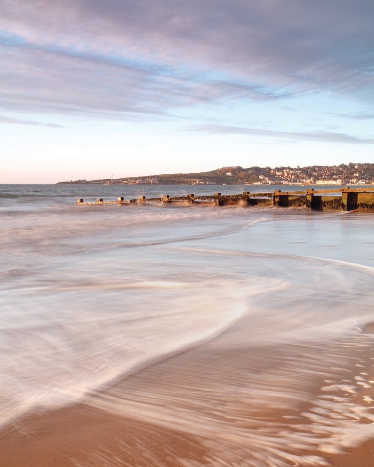 Purbeck scene. Swanage Bay groynes at dusk