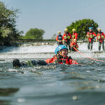 Trainee floating in the water using a tension Diagonal Safe Working Near Water