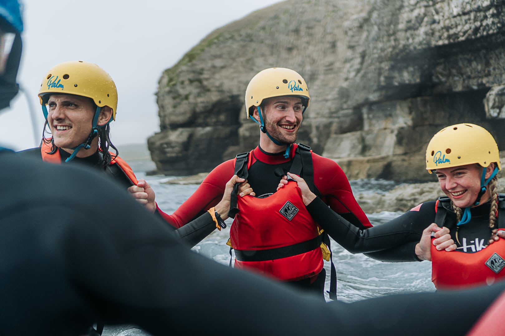Outdoors, in the sea, group holding onto each other, smiling - Neurodiversity Jobs